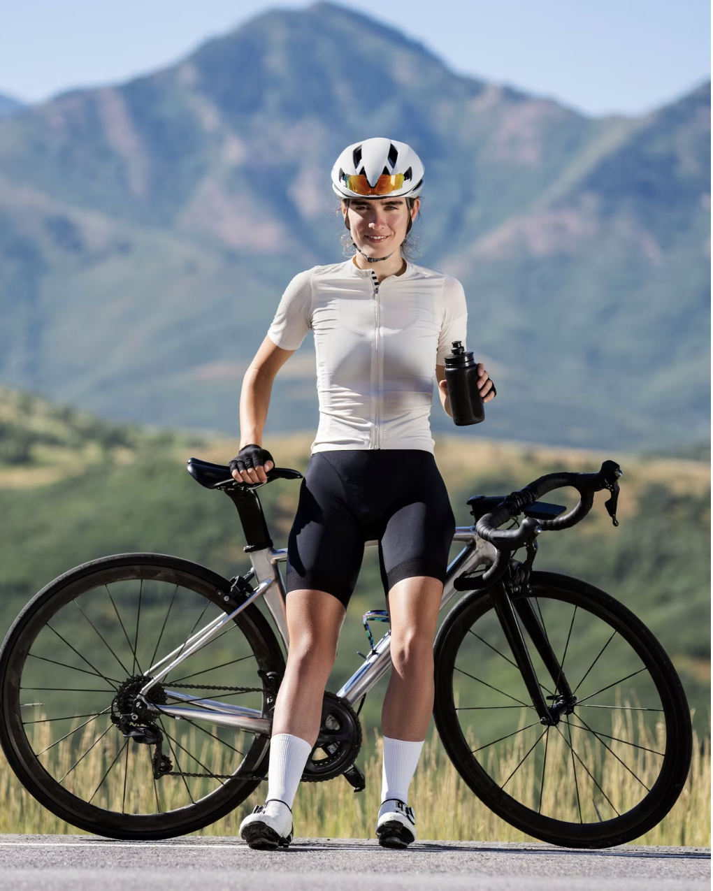 Woman cycling with bottle